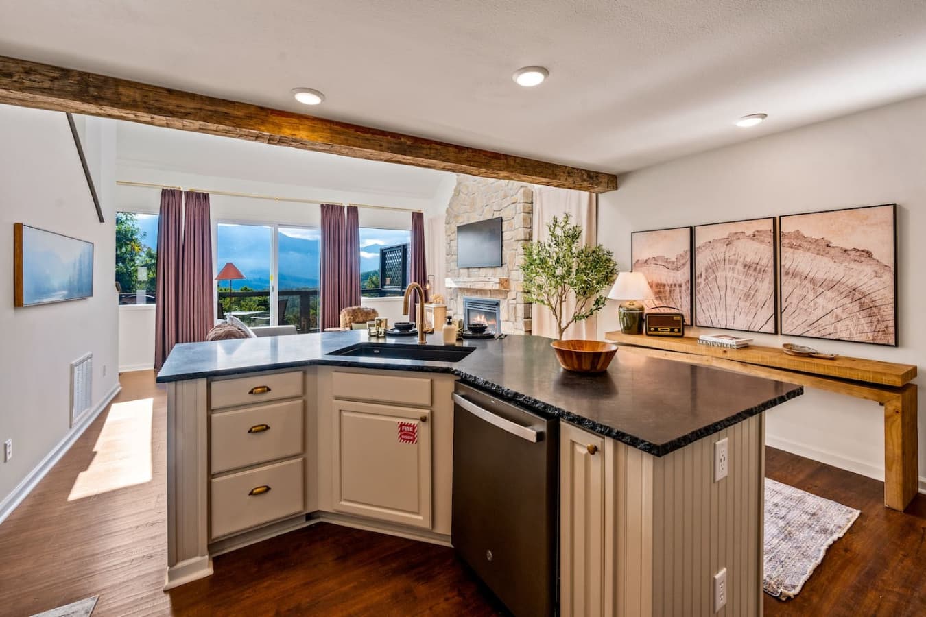 Large windows frame the stunning mountain backdrop, turning everyday cooking into a serene experience.