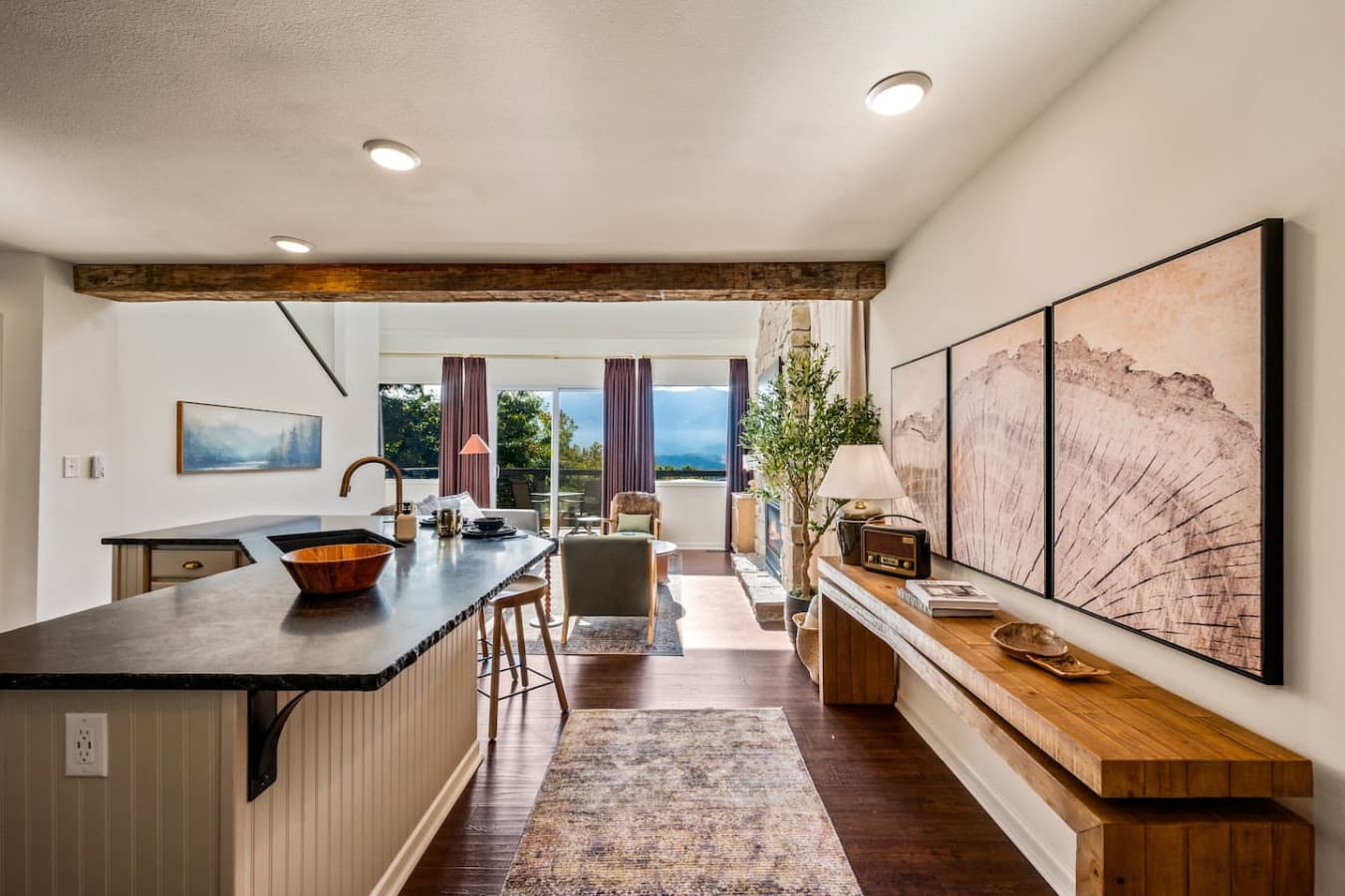 With the open floor plan, the main living area seamlessly connects the kitchen, dining, and living spaces, all oriented to maximize breathtaking views of the Smoky Mountains.