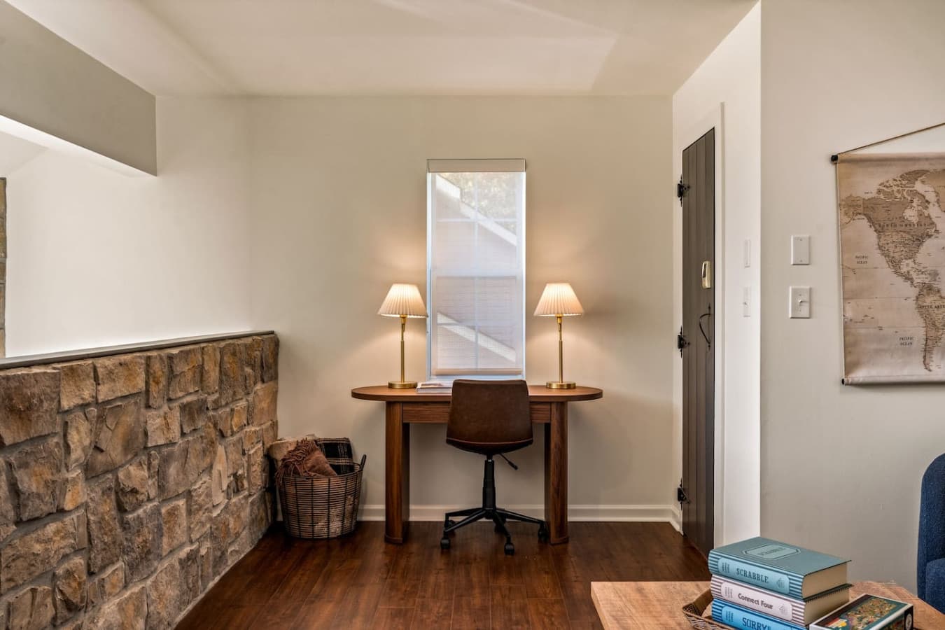 Sunlight streams through the windows of the upstairs workspace, creating a bright and inspiring spot for focus and creativity.