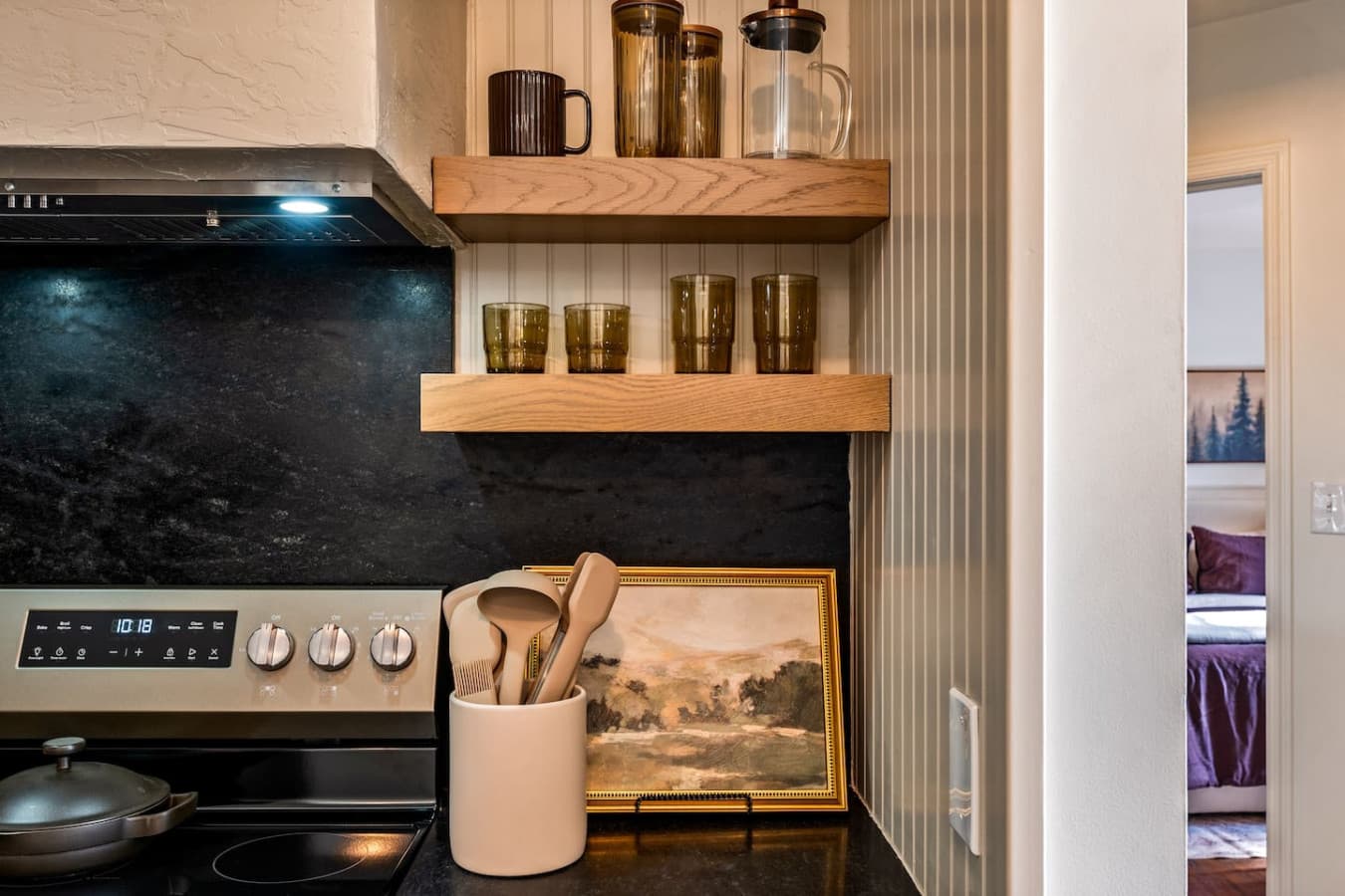 Clean lines, modern finishes, and warm wood cabinetry bring a contemporary touch to the mountain-inspired space.