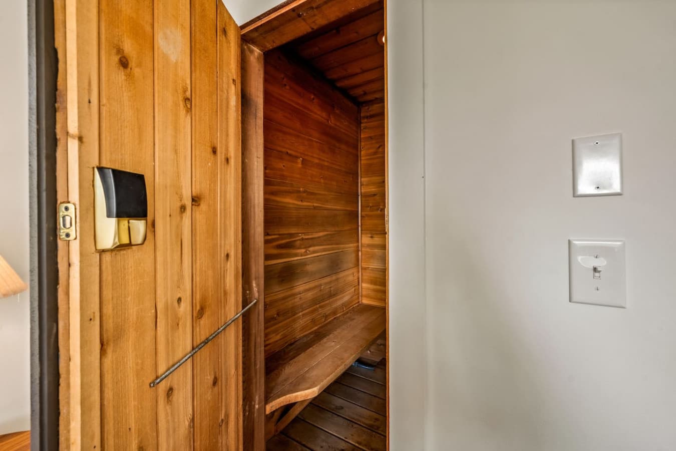 The intimate two-person sauna invites guests to unwind in warmth and tranquility during their stay.