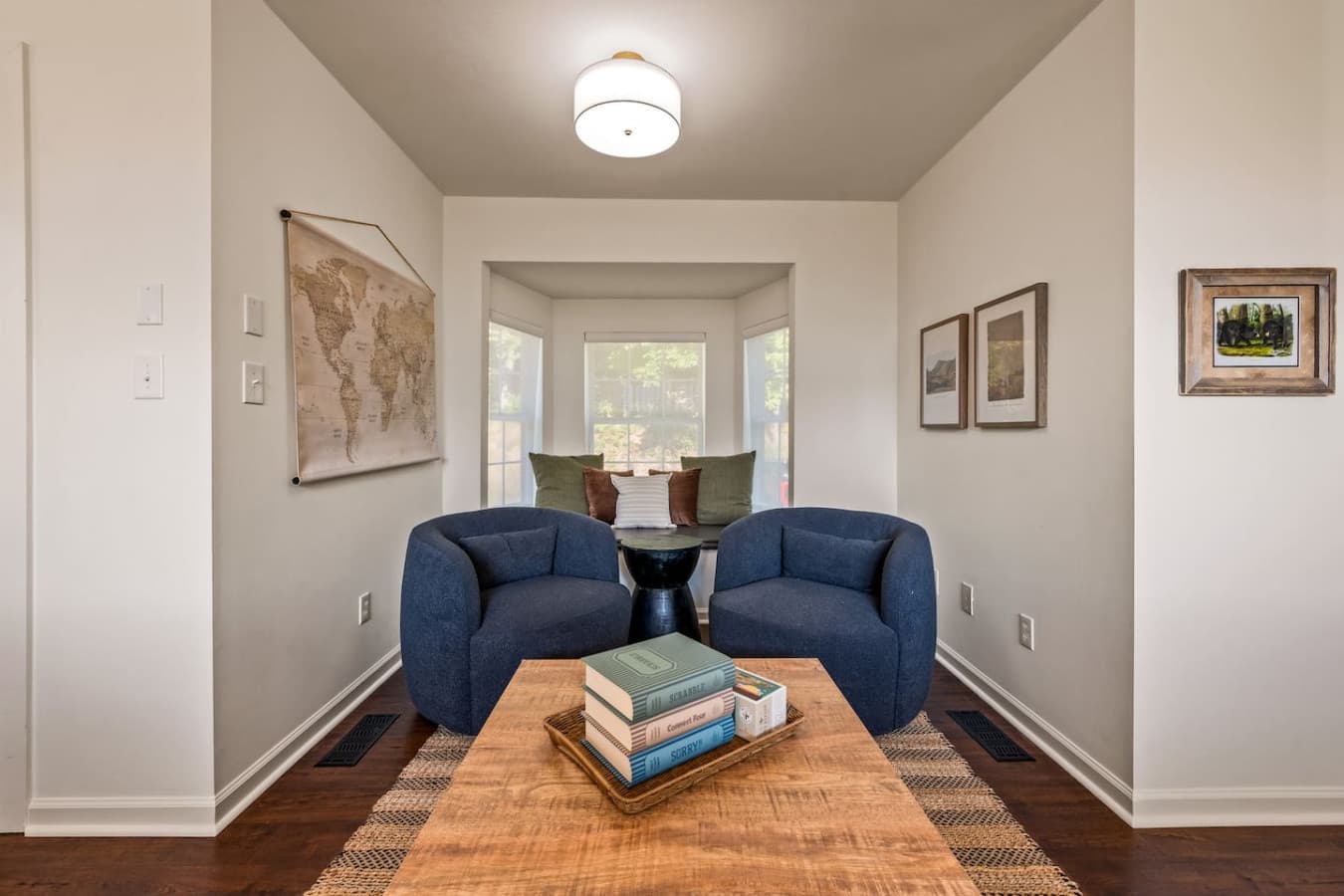 Plush seating and warm wood tones create a snug hideaway perfect for curling up with a good story.