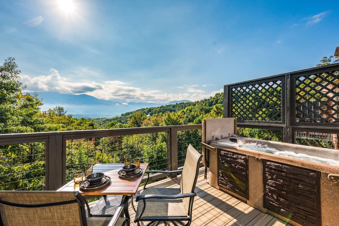 This inviting outdoor space offers the ideal setting to share meals or unwind while soaking in fresh mountain air and picturesque scenery.