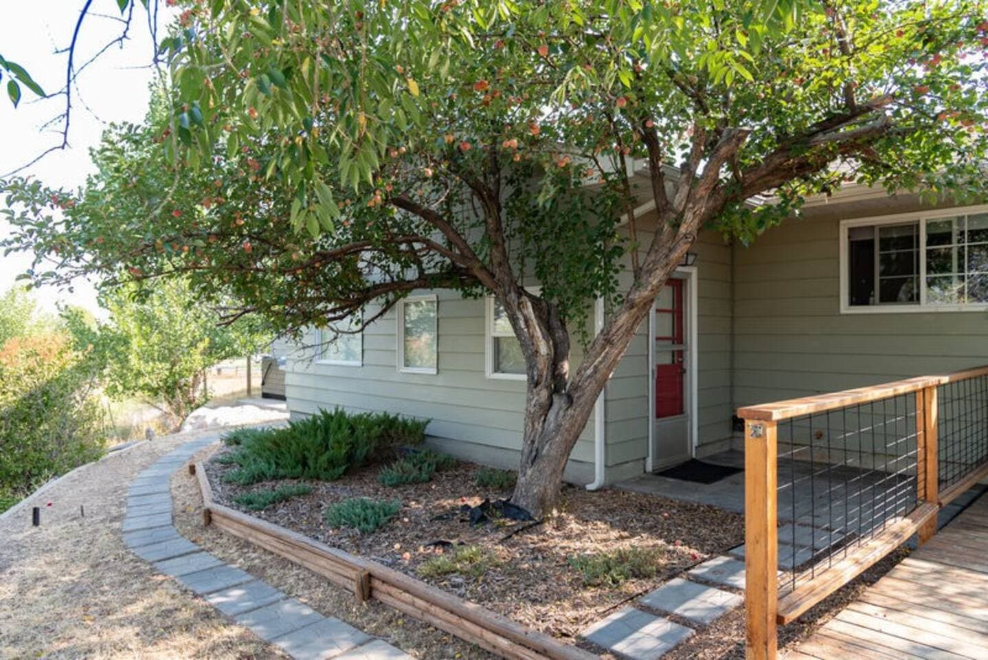 Beautiful plant life can be found throughout the property as shown at the back of the second unit. (Wind River Quarters).