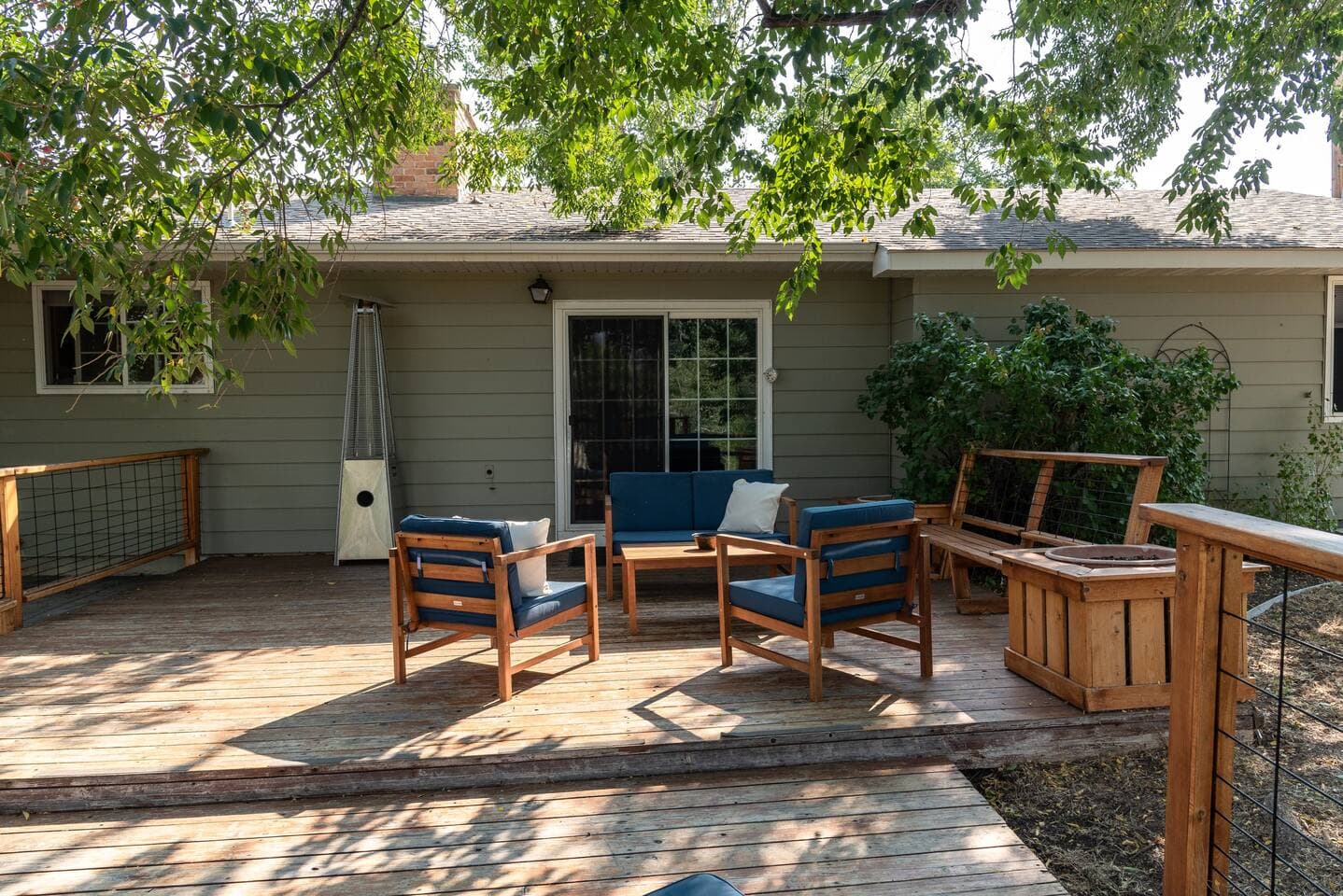 Relax in the shade under the large beautiful tree. On cooler nights an outdoor space heater is available for your convenience.