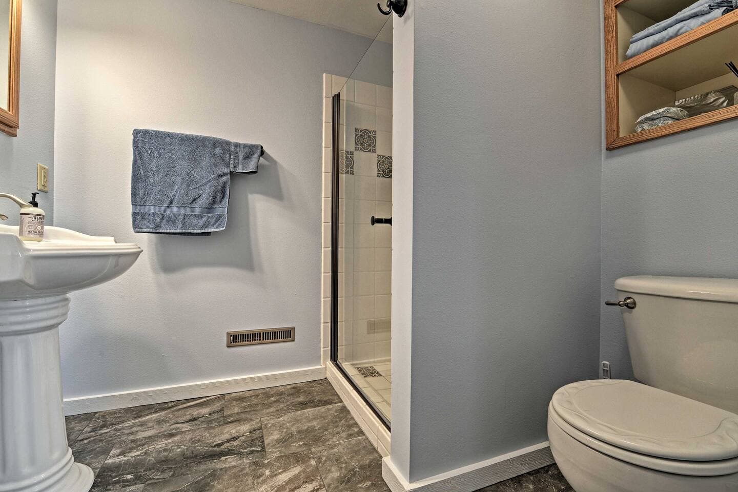 Full bathroom with walk-in shower.