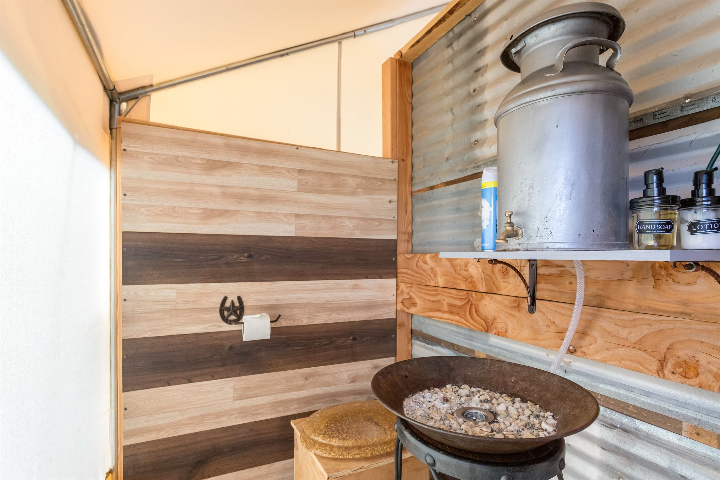 Private bathroom inside. Containing towels and shower products