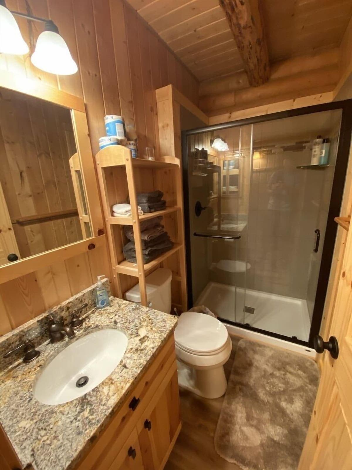 Beautifully renovated bathroom features a walk-in shower.