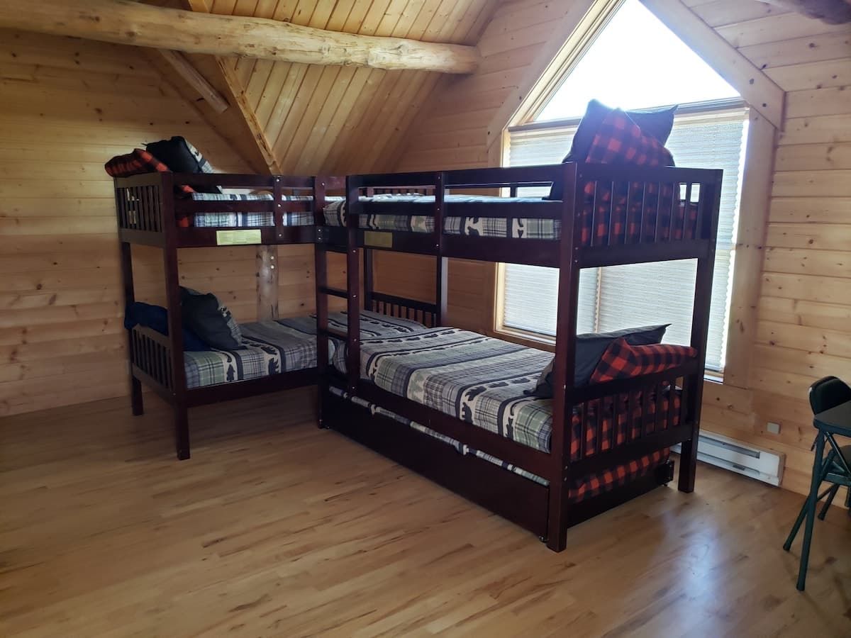 Loft bunk house has 2 sets of twin bunk beds.