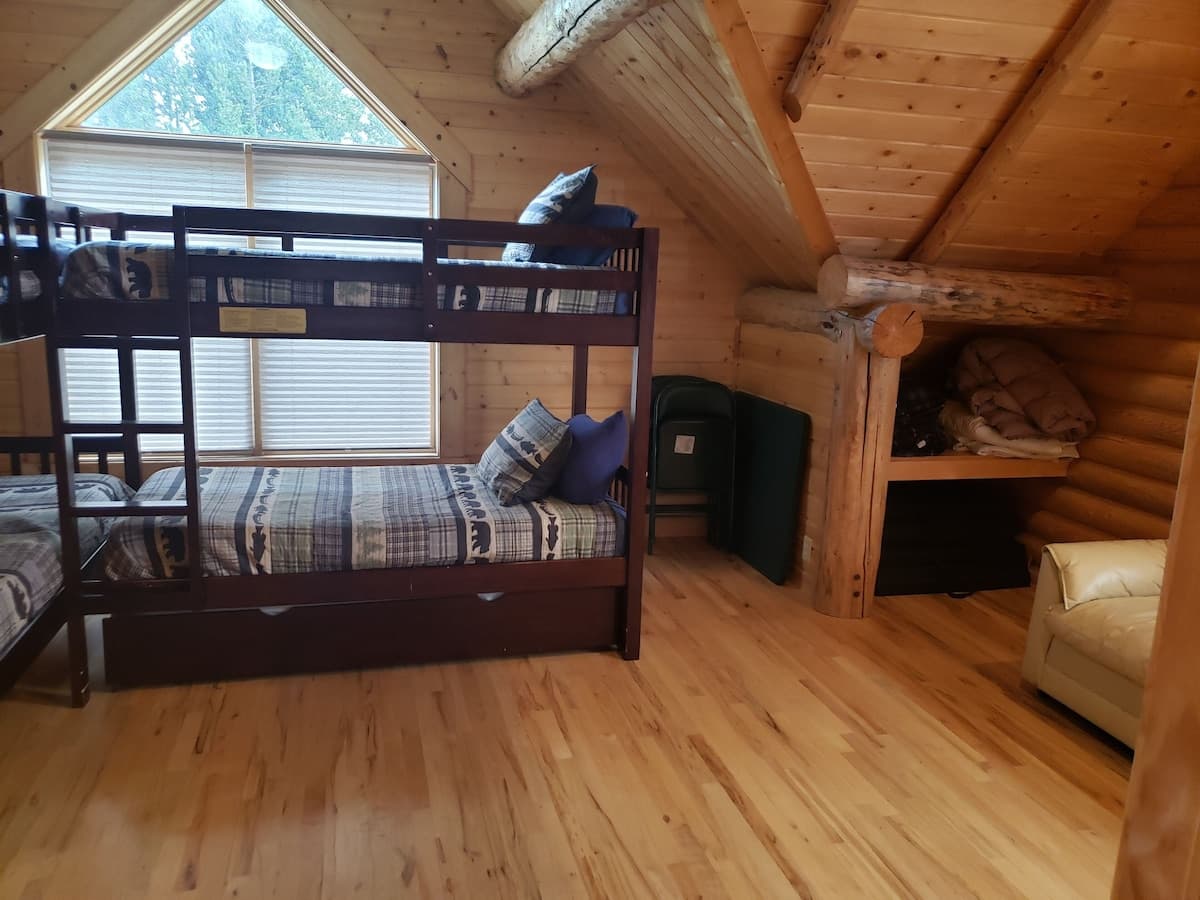 Extra blankets and storage in the bunk room.