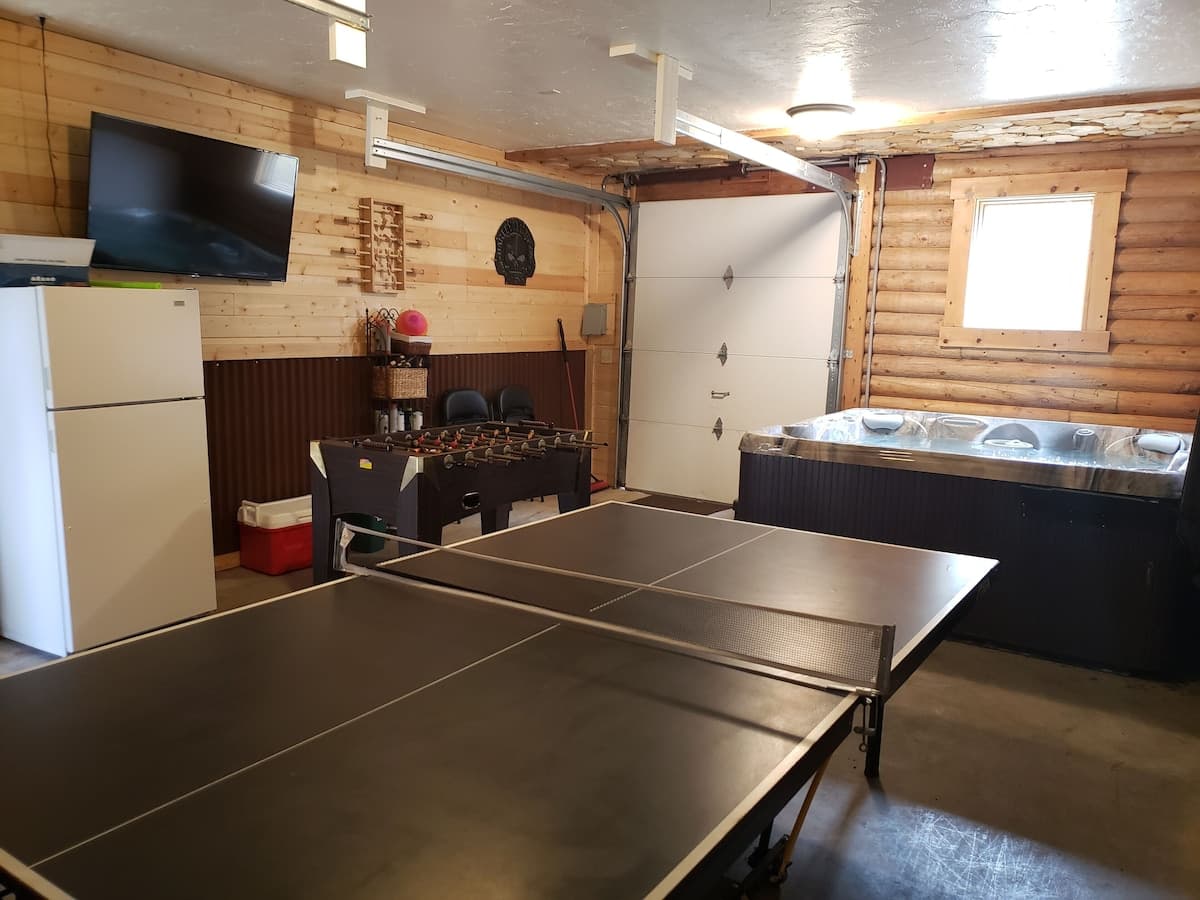 Have fun in the heated game room! Snow or shine you will have a blast in this converted garage.