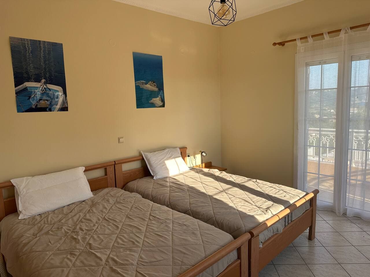 Upper floor room 1 with 2 single beds, A/C and balcony