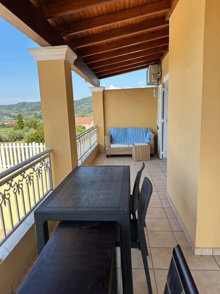 Ground floor balcony adjacent to the living room, outdoor dining area