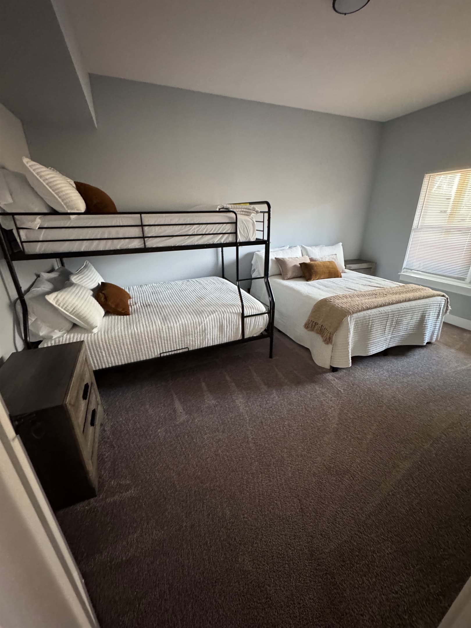 Lower level 
Full over Queen Bunk and Queen bed. Shares bath with King bedroom on that level
