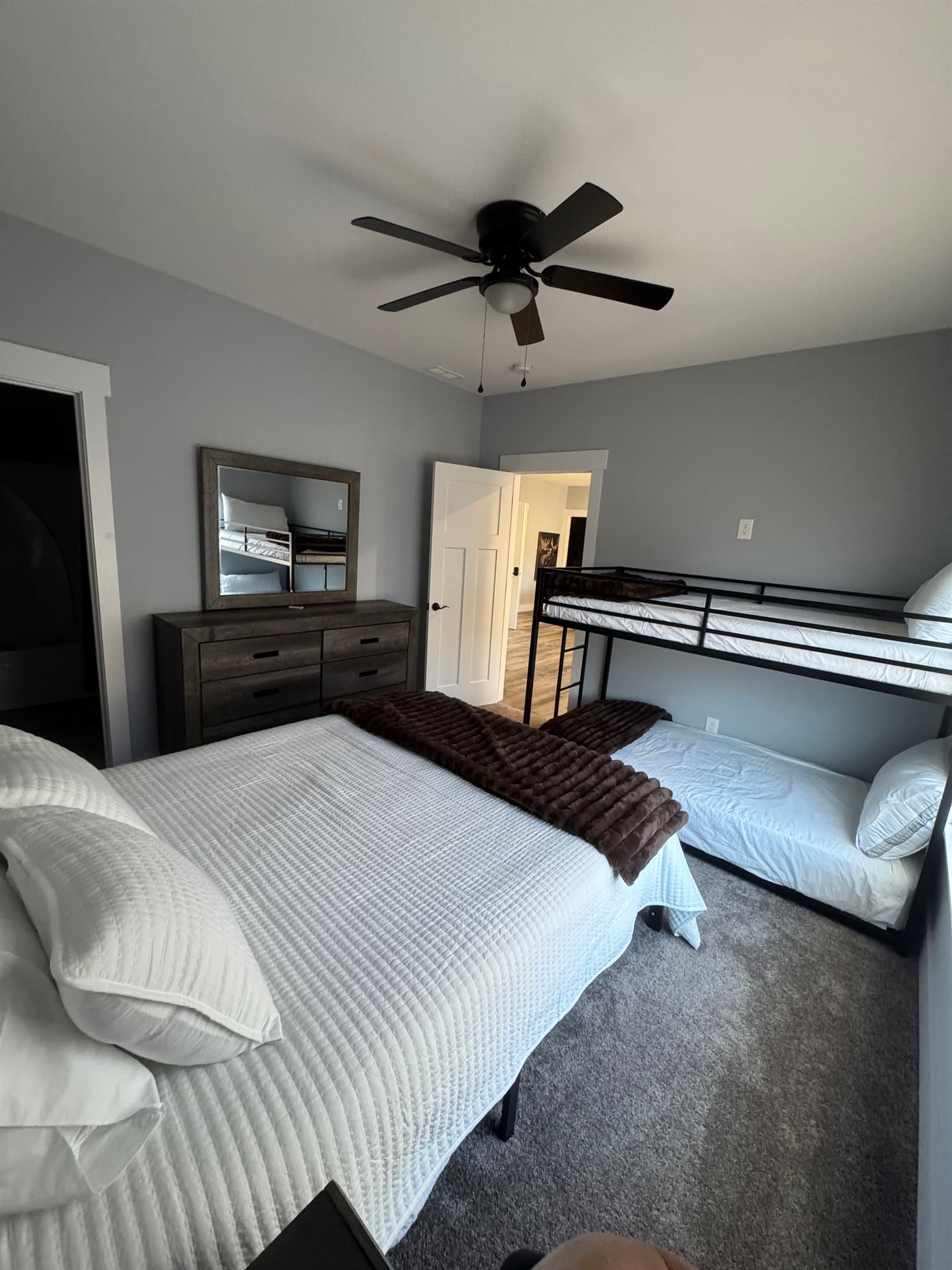 Middle floor Queen bedroom with twin/twin bunks. Ceiling fan and private bath