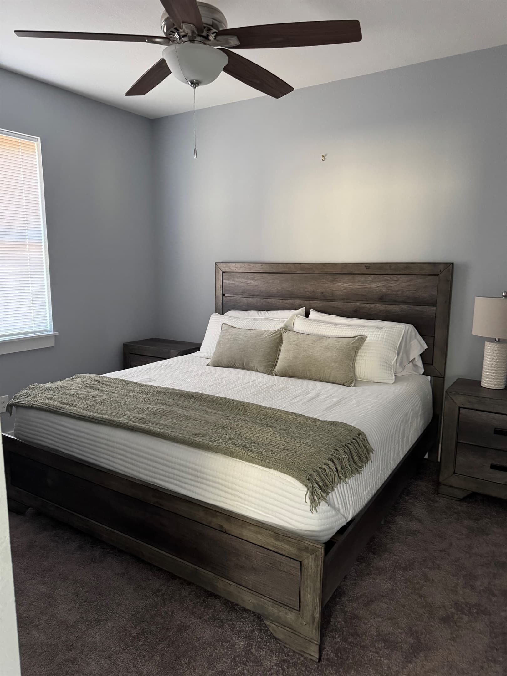 Main level King bedroom 2, ceiling fan, private bath. 