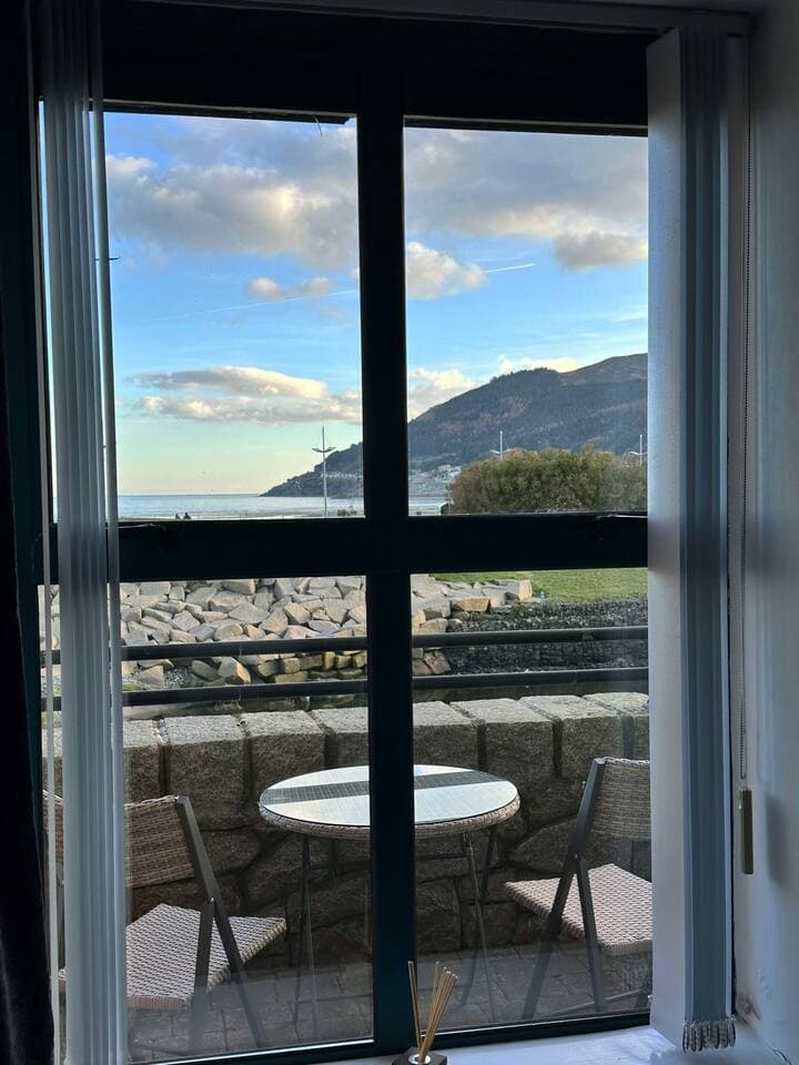 King bed with Mourne mountain and sea views