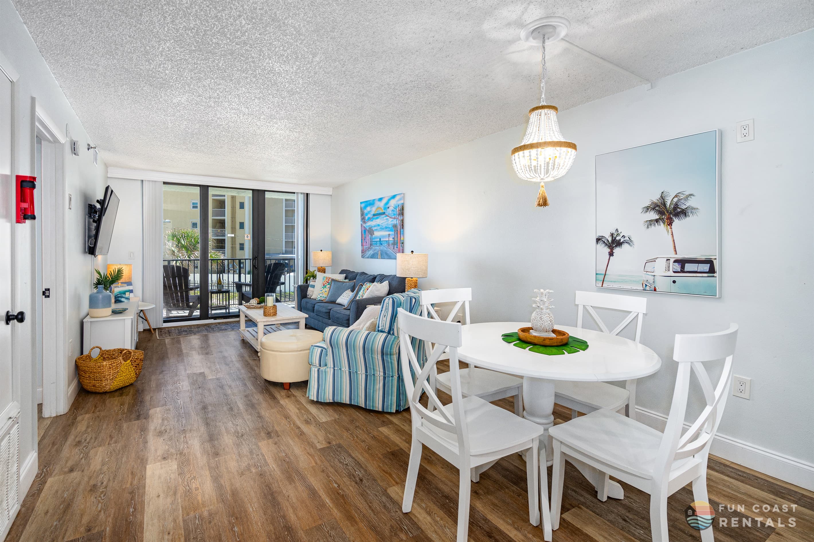 Spacious Living Room Area with 55" Smart TV and Dining Area