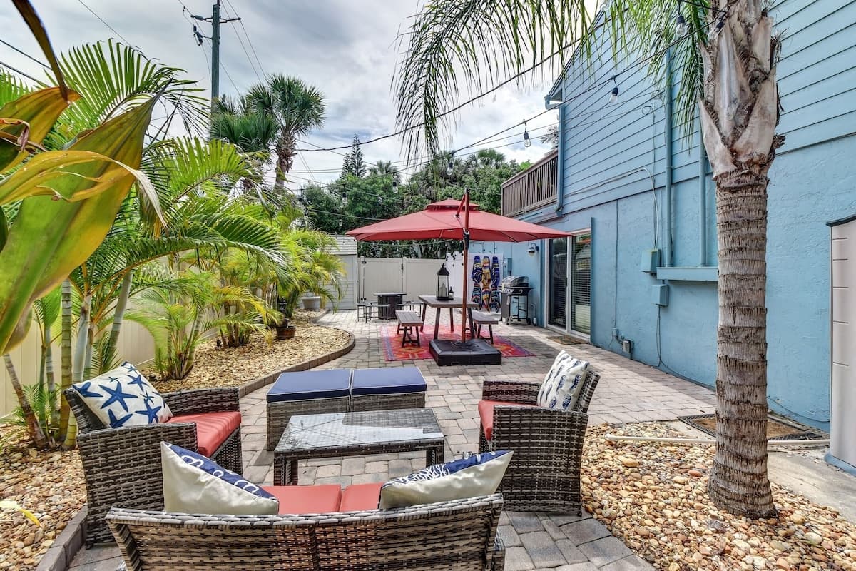 Private Fenced String-Lit Yard with Dining Table, Fire Pit, and BBQ Grill