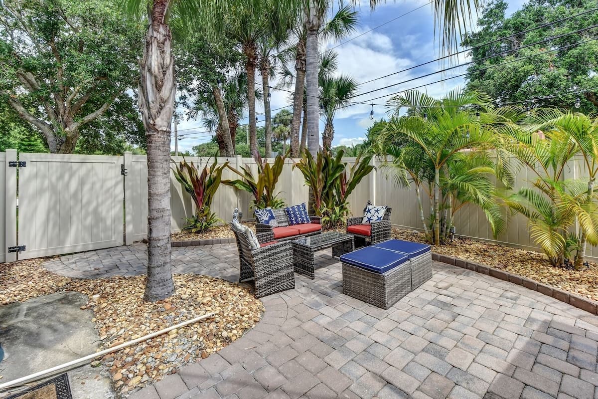 Private Fenced String-Lit Yard with Outdoor Seating
