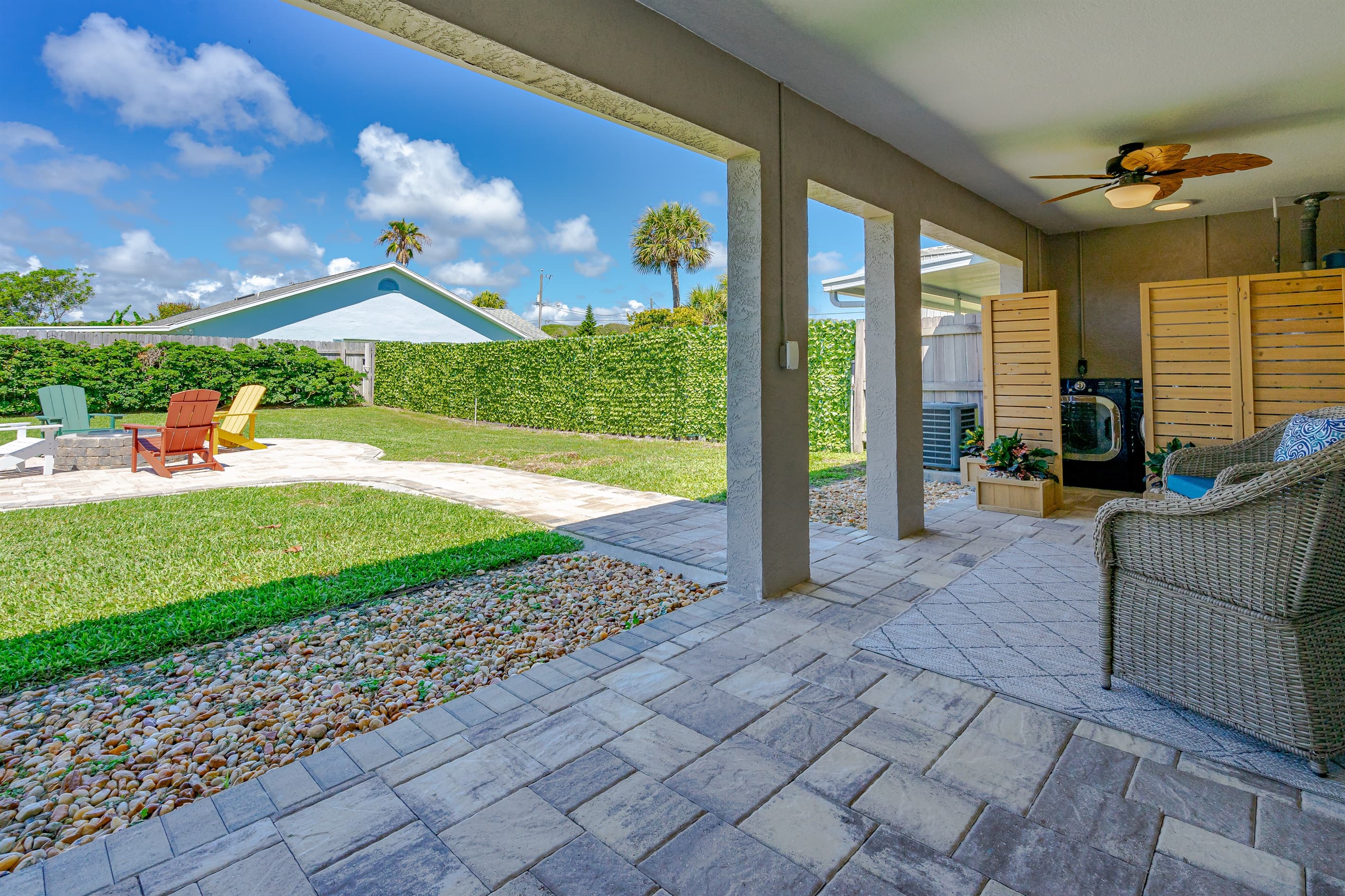 Fenced Backyard w/ Inviting Seating and Adirondack Chairs