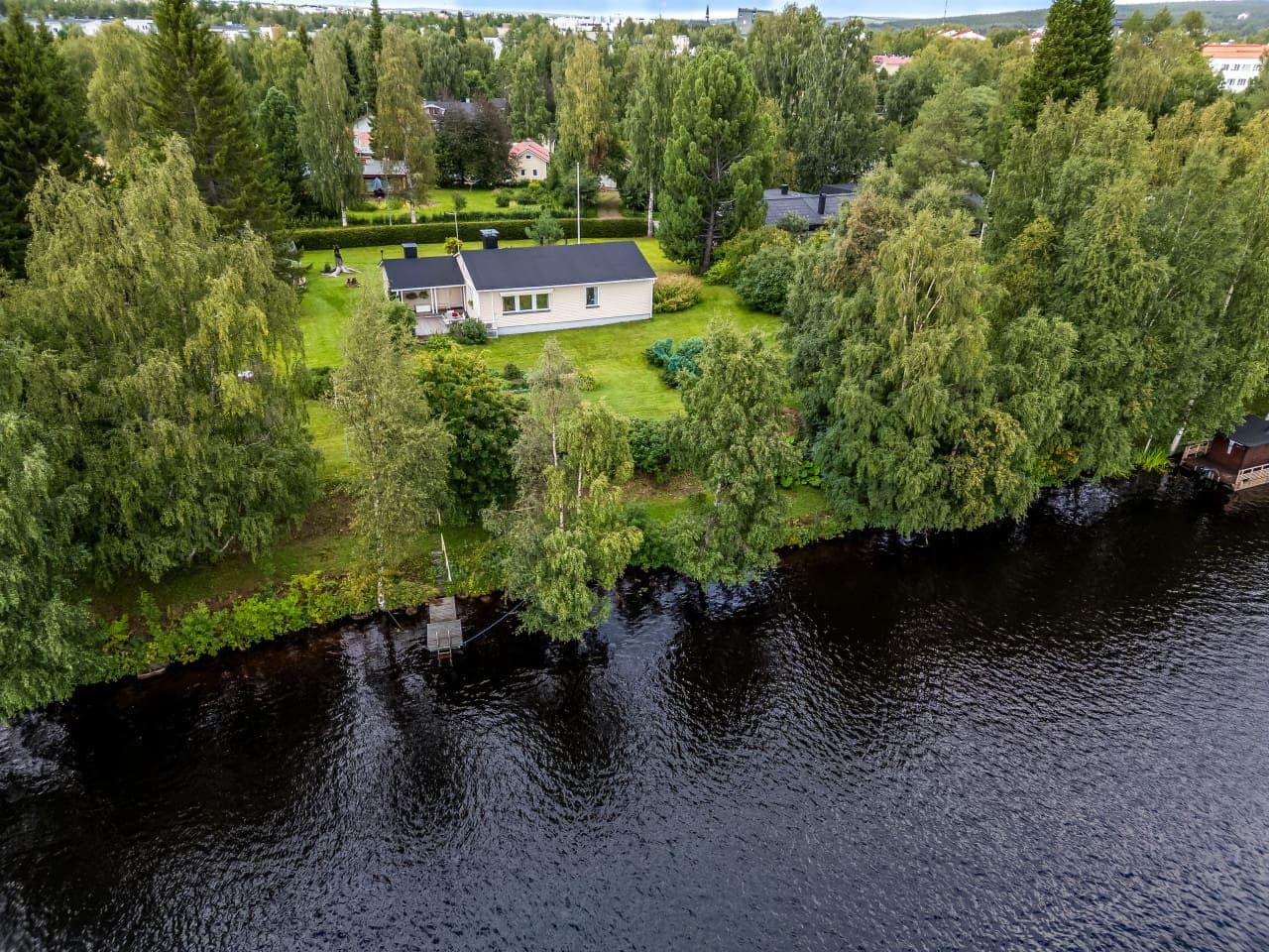 Enjoy stunning water views and direct lake access from this cozy home nestled among lush greenery.