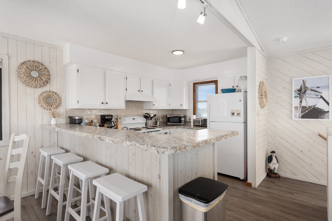 Open kitchen w/ spacious island seating, perfect for casual meals & gathering while cooking