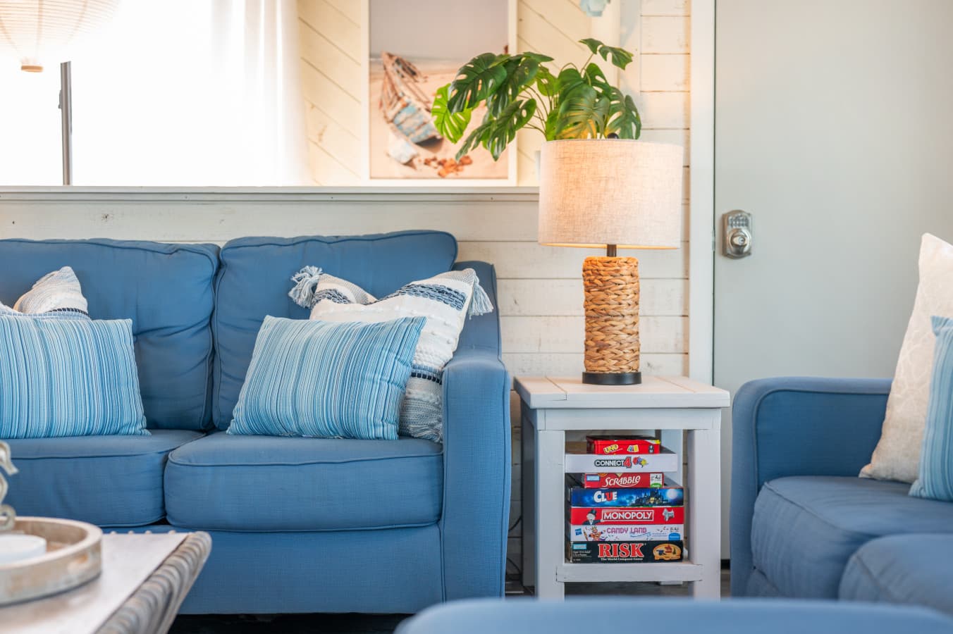 Cozy seating area w/ plush sofa, soft pillows & side table lighting