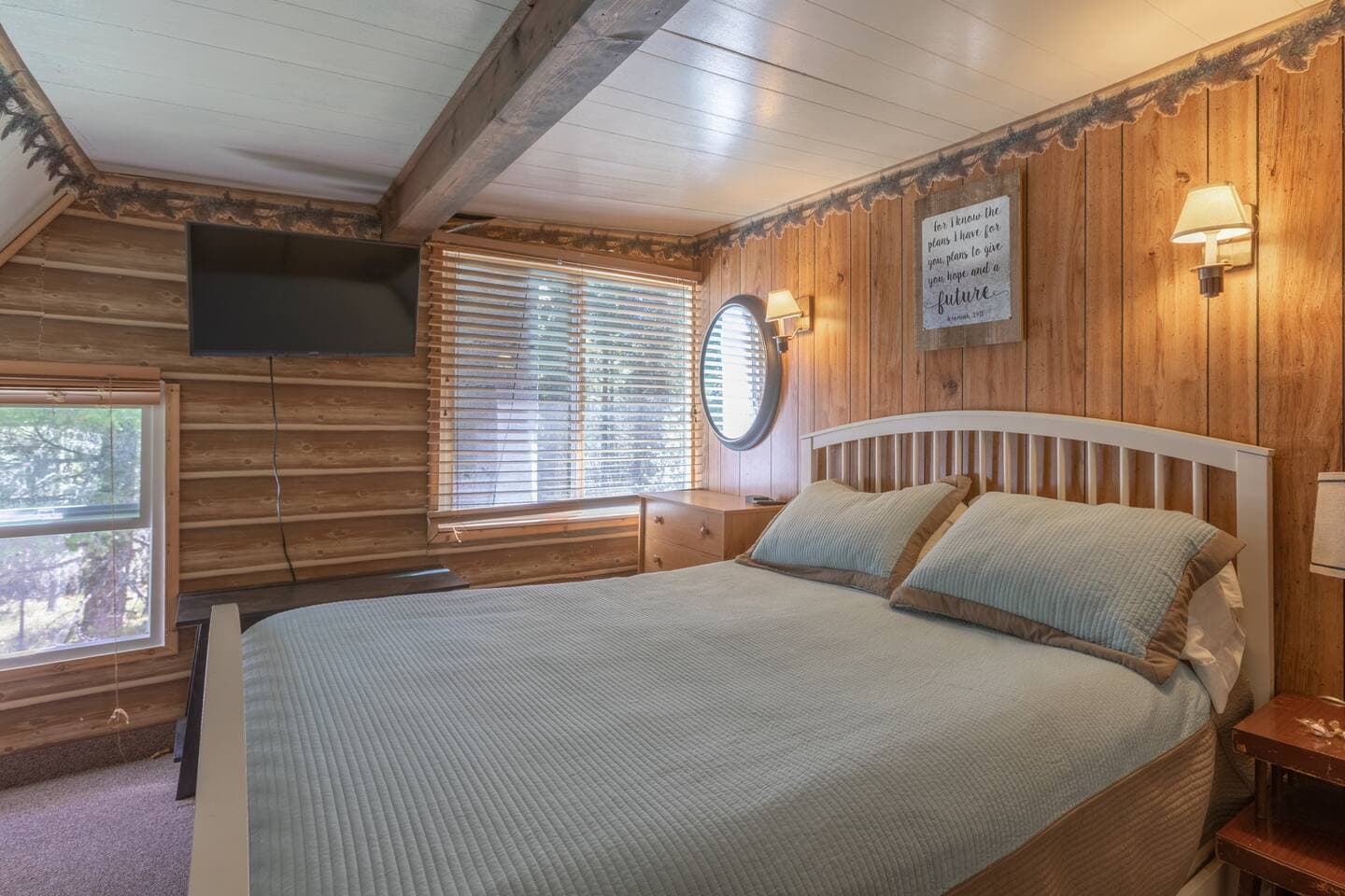 Bedroom 5 with queen bed and smart TV.