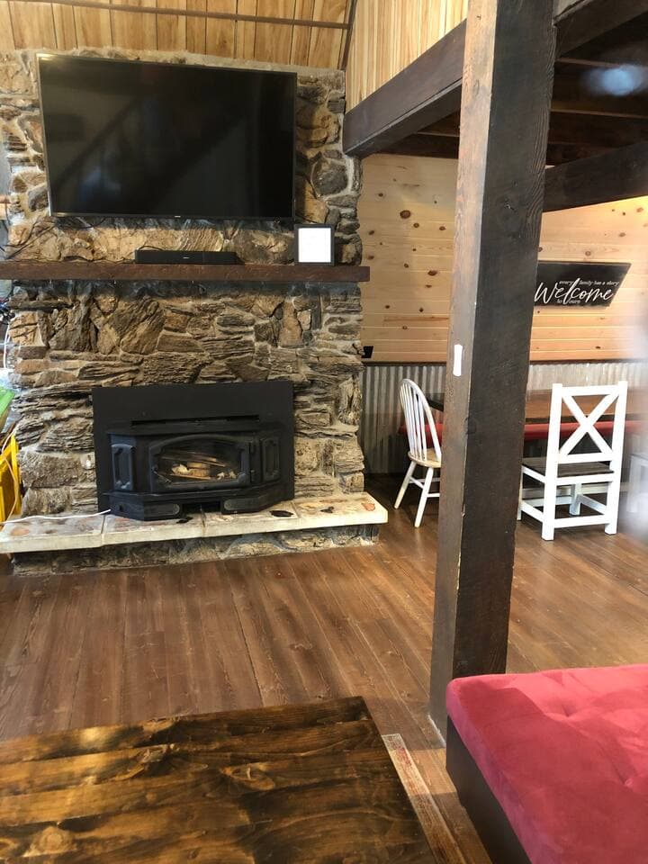 A large stone fireplace is the perfect place to gather 