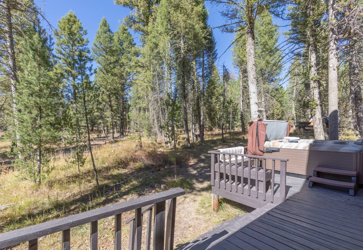 Enjoy evenings relaxing on the porch with beautiful wooded views.