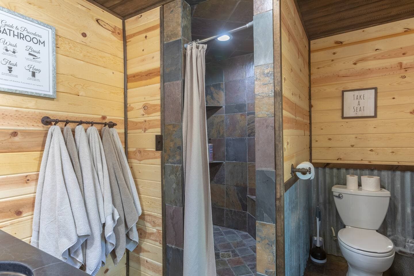Bathroom 2: Amazing large walk in shower with bench area to sit and relax.  Plenty of towels are provided as well.