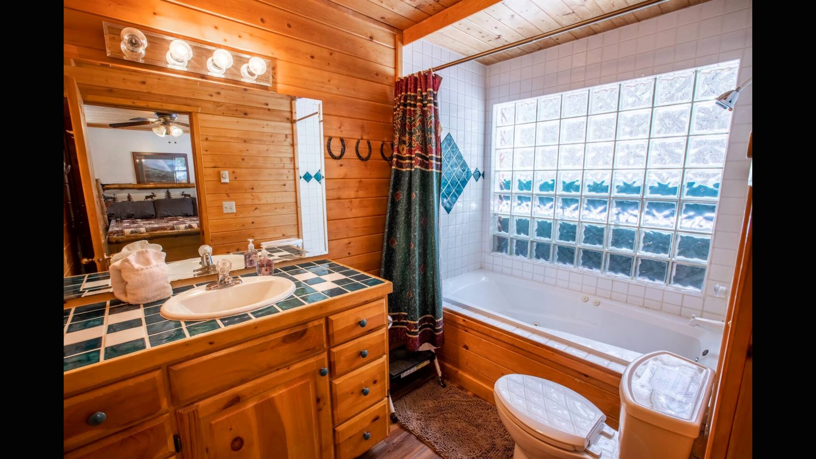 Cabin style bathroom with shower/bathtub combo. Perfect if you have littles on your trip.  Lots of natural light.
