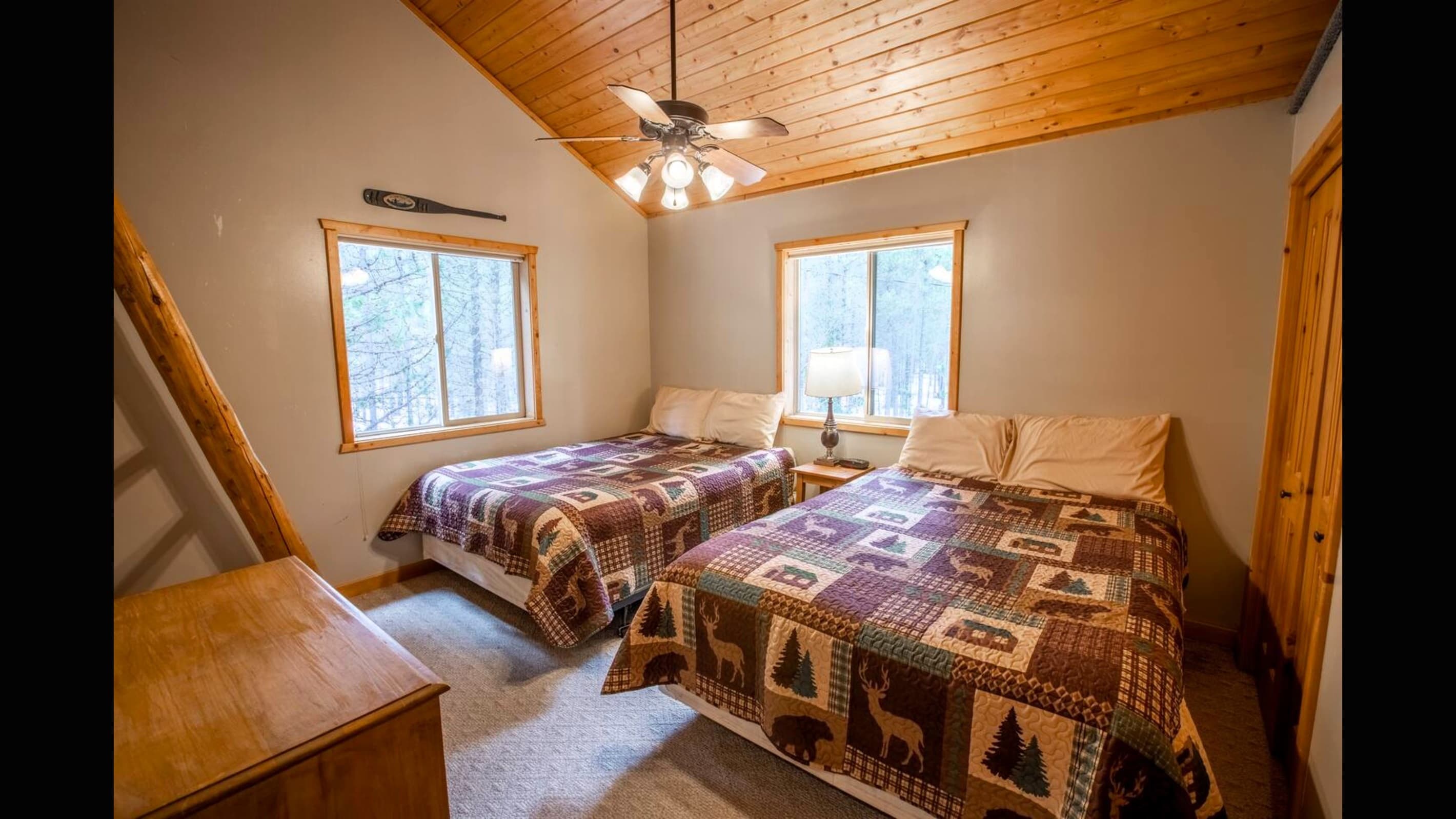 Bedroom #3 has two queen size beds and a ceiling fan.