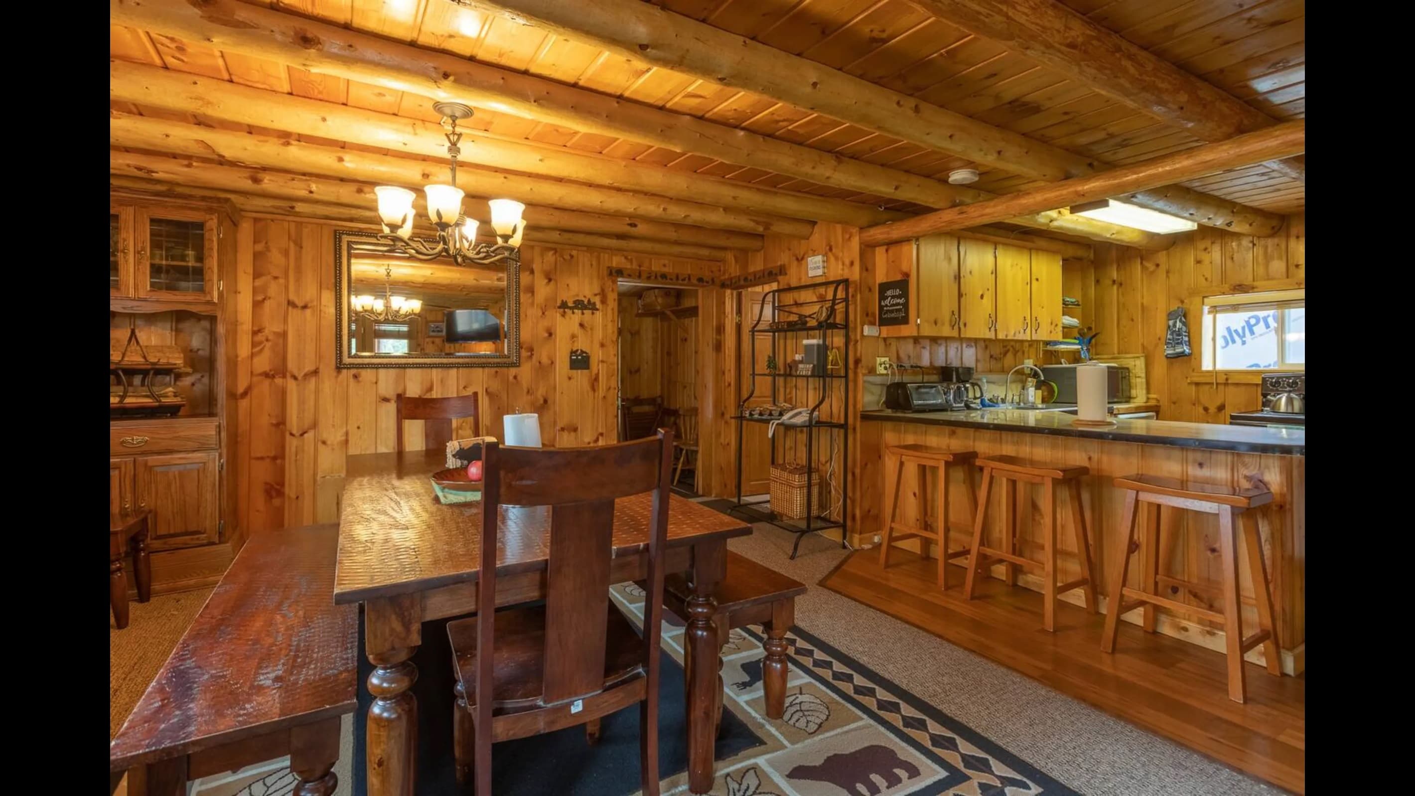 This home has so much seating at the dining table with additional chairs you can pull in and more seating at the counter.