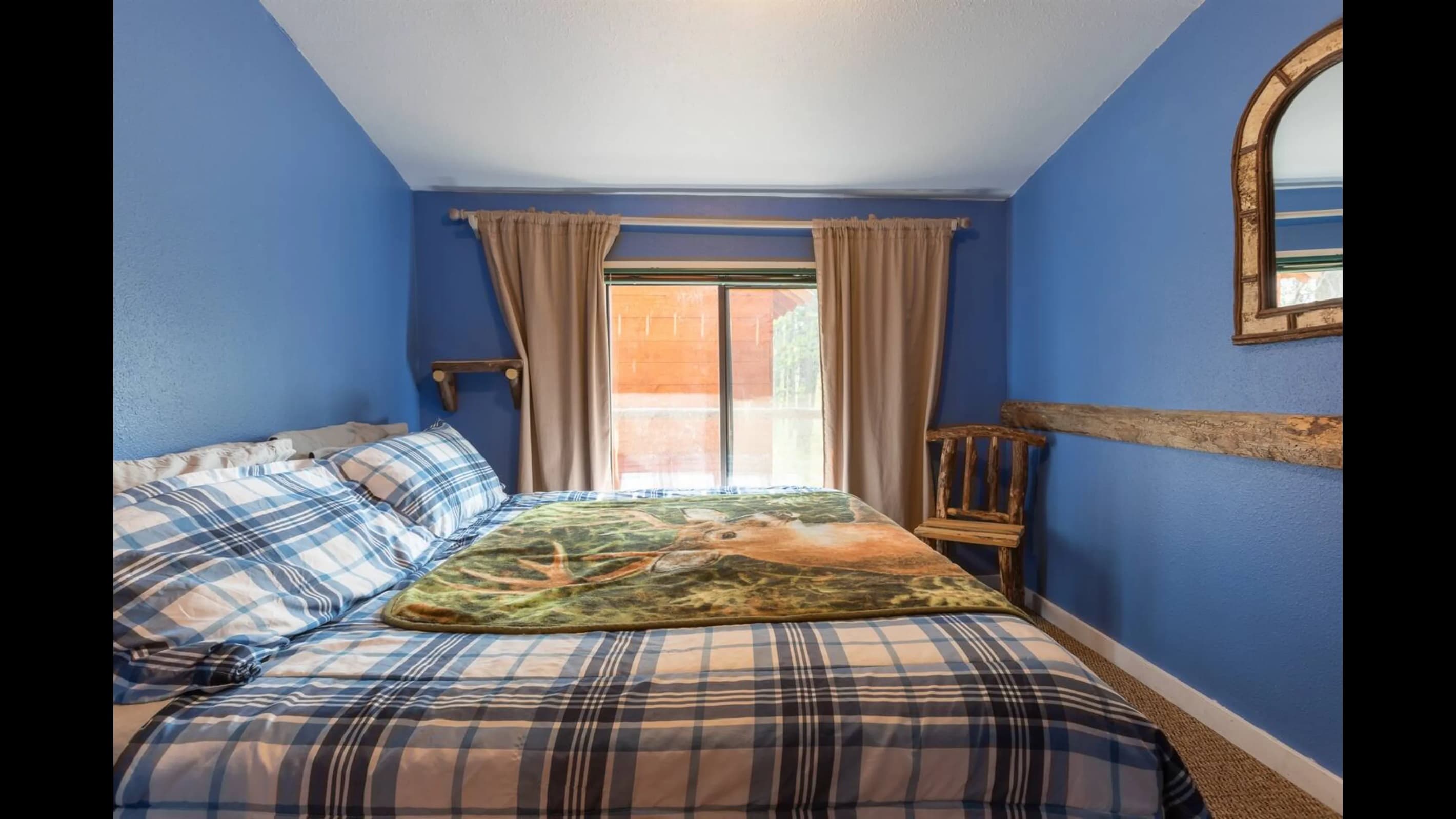 The downstairs bedroom has a king size bed.