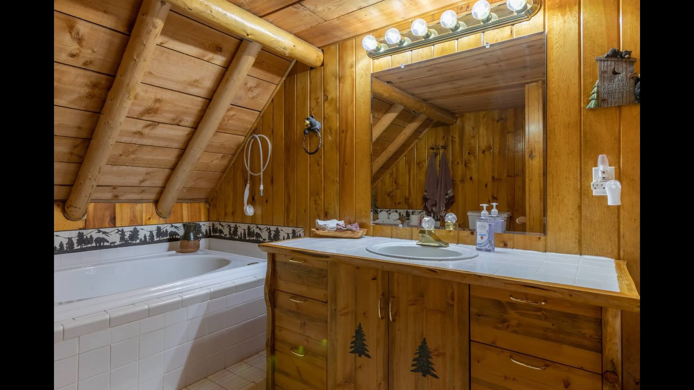 The upstairs has a large bathroom with plenty of counter space and a soak in tub!