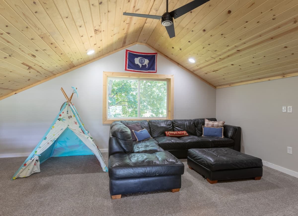 Loft with Large Sectional and TV. The perfect place for kids to play! Great views from here as well.