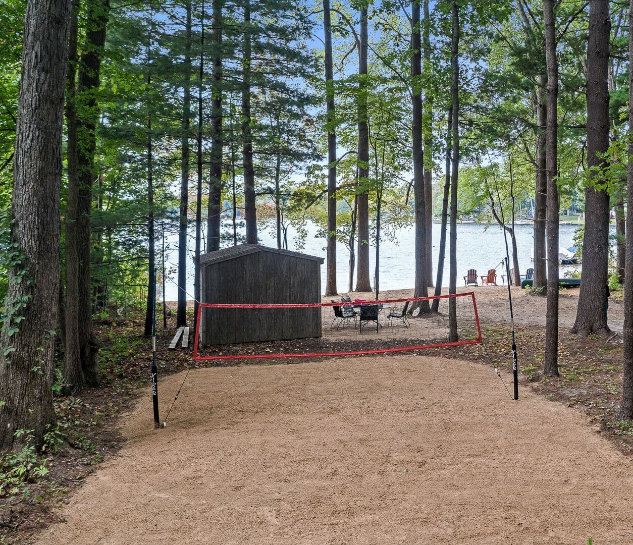 Beach volleyball court with the lake behind.