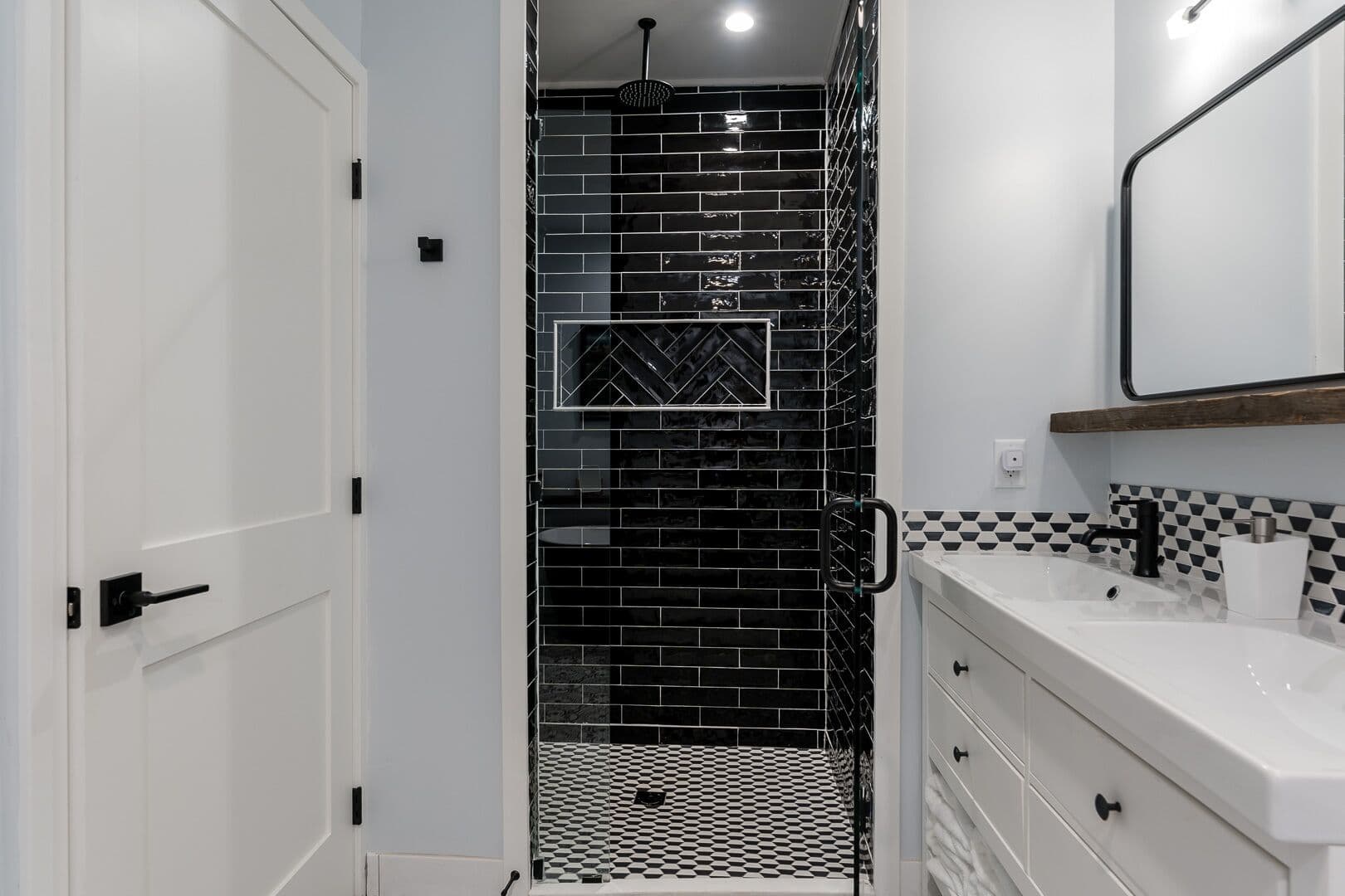 Large rainshower shower head and a hand-held shower.