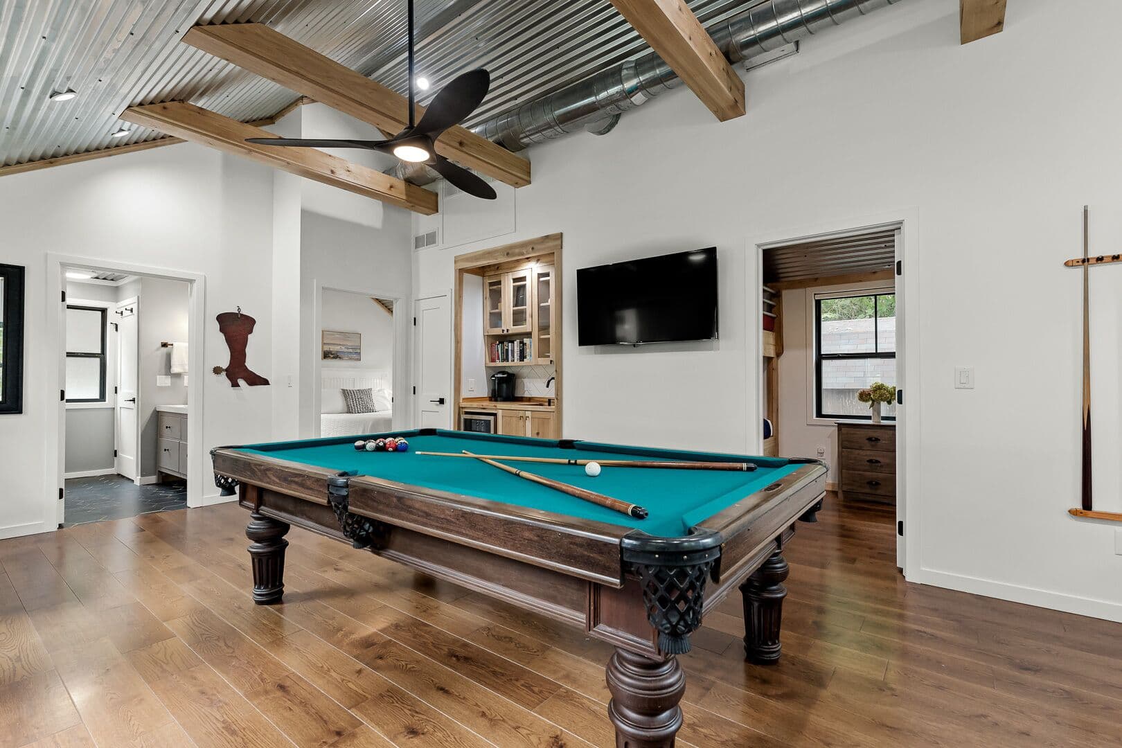 Entering the guest house with its 8' pool table, beverage center, and TV.