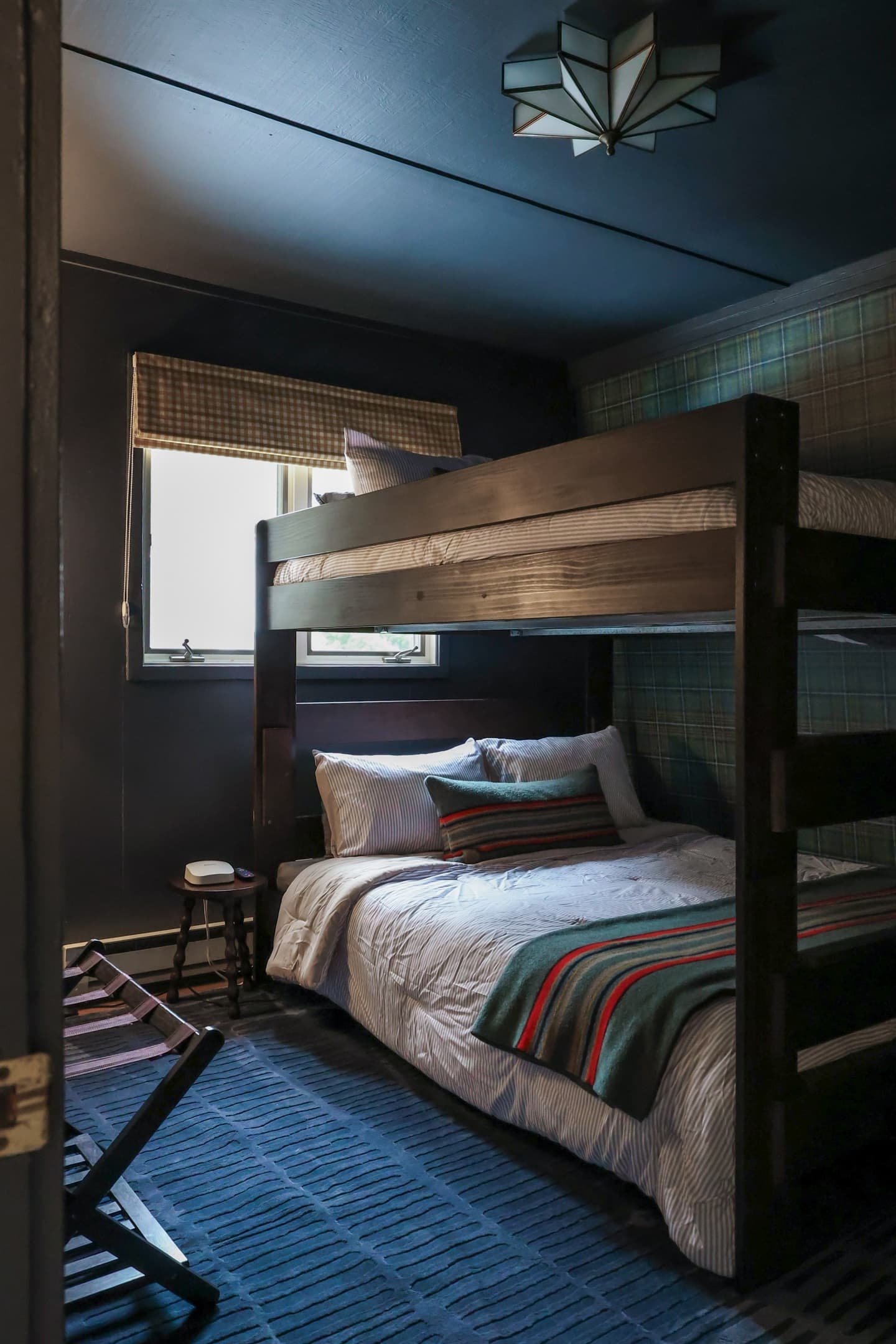 Queen over queen bunks in this room along with a tv make it a perfect landing spot for the kids of your group!