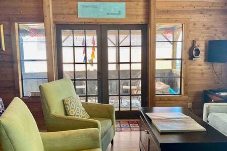 The large living room opens up to the covered waterfront patio for entertaining and relaxing.