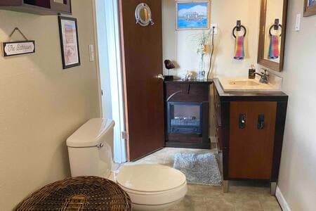 Ensuite bathroom stocked with towel sets and essentials.  