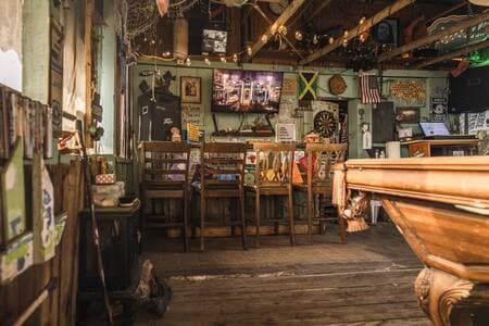 The tiki bar at Runaway Bay Lodge offers meals upon request.  