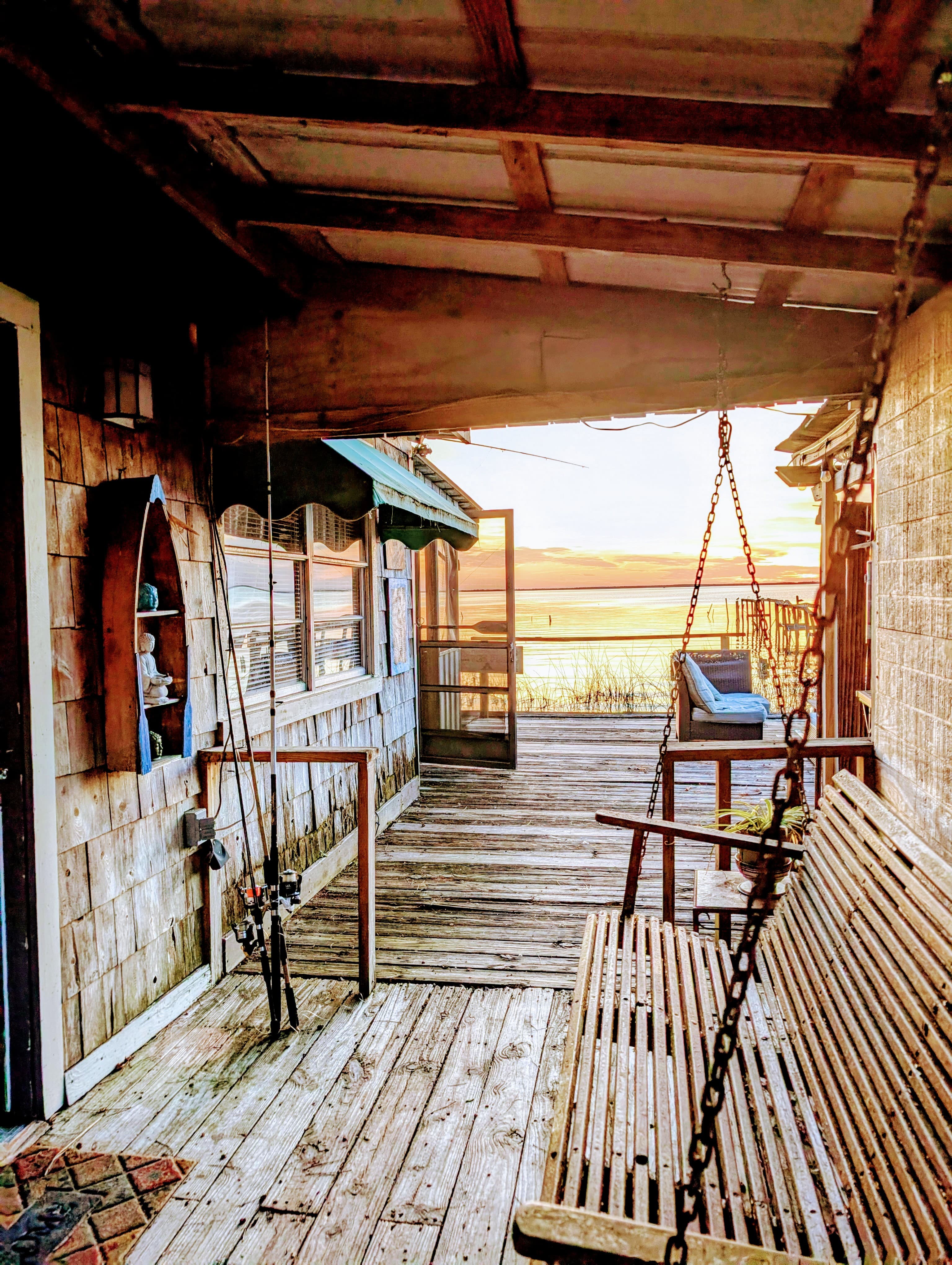The front porch features a swing  with lake view and all rooms in the cabin have water views.