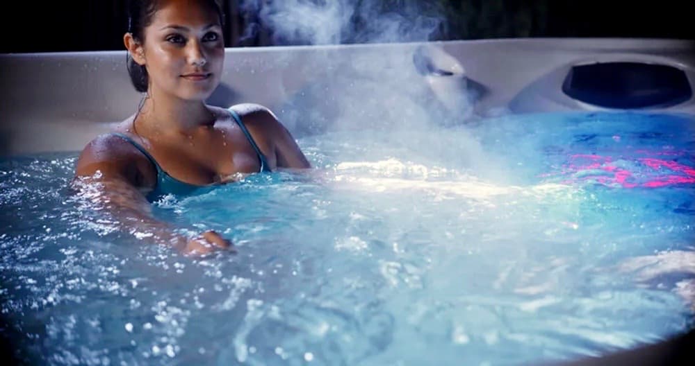 Relax in our clothing optional 4 person waterfront hot tub