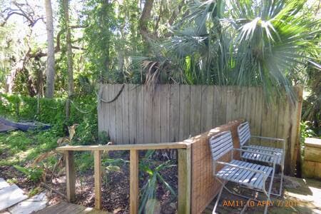 Small back patio with water and conservation area view.