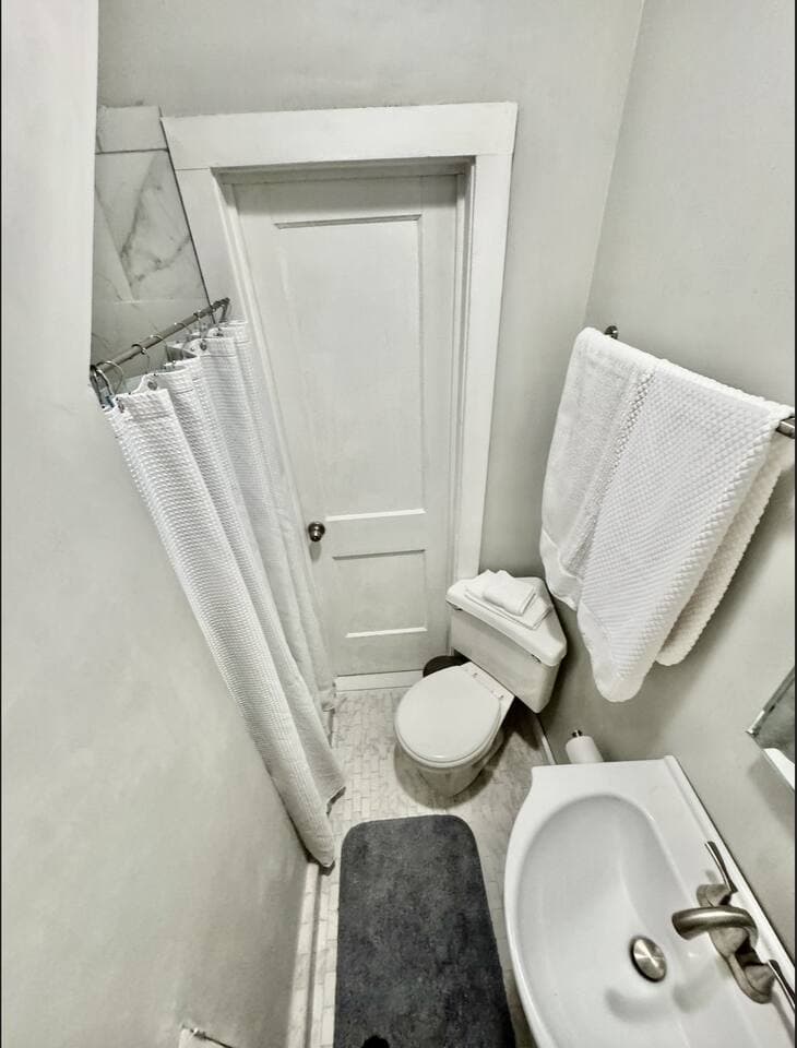 Full upstairs bathroom with marble shower