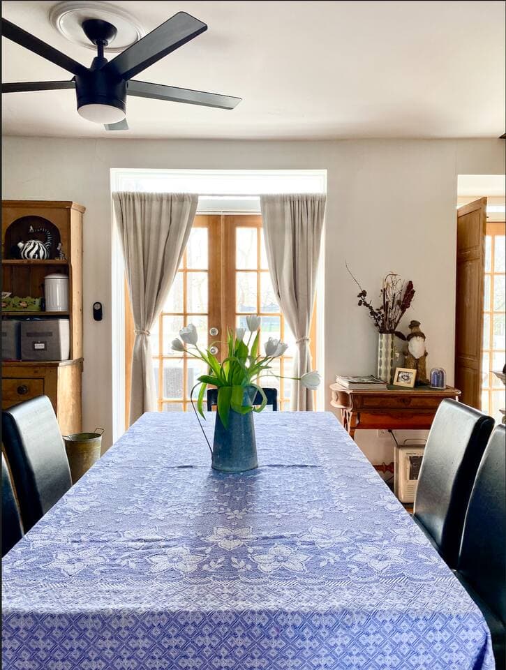 Dining area from angle toward the French doors - with a bright tablecloth for Spring!